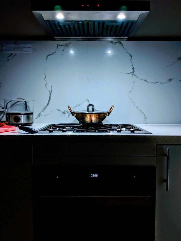 How can a UK artisanal cheese producer meet the Food Standards Agency's requirements?